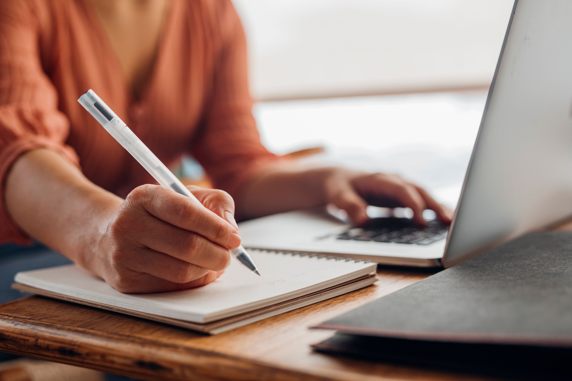 Women in Business: Anonymous Young Businesswoman Using a Laptop While Working from Home